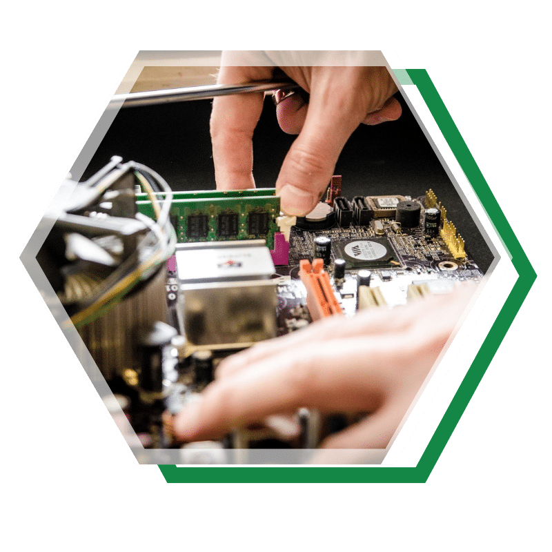 Close-up of hands installing RAM on a desktop motherboard