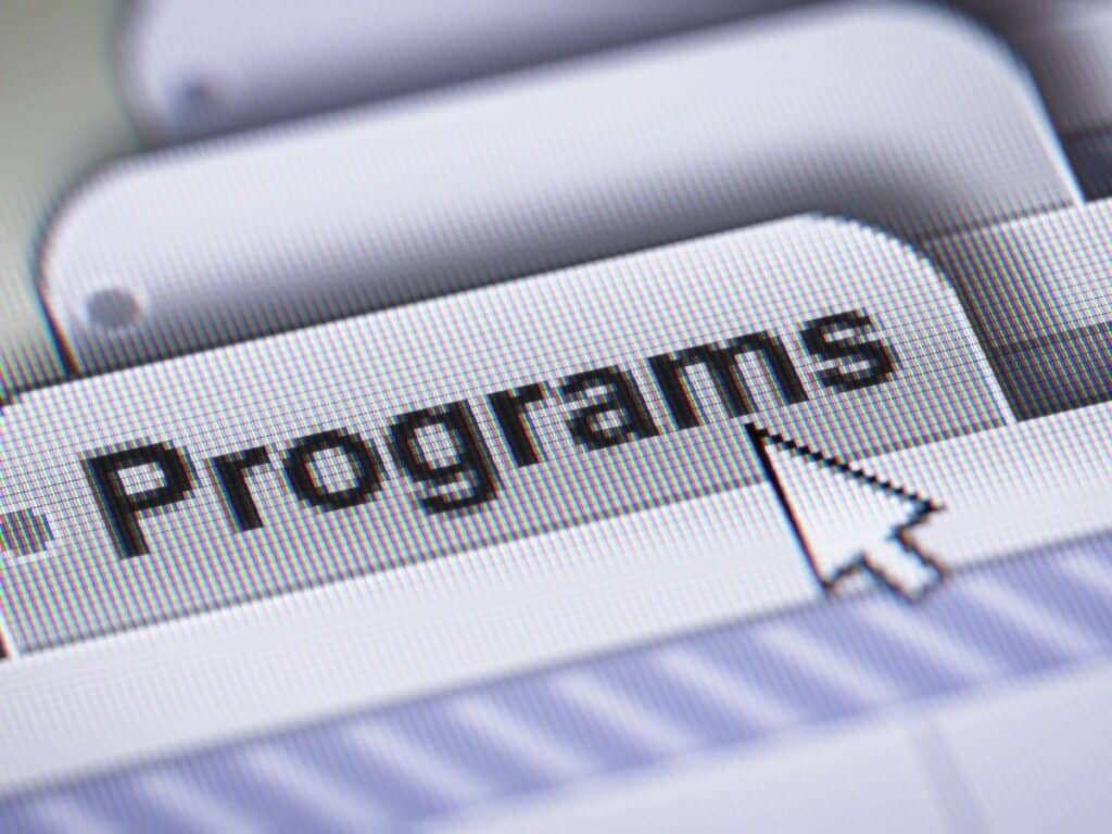 Cursor clicking on 'Programs' button on screen