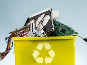 Recycling bin filled with discarded tech and circuit boards